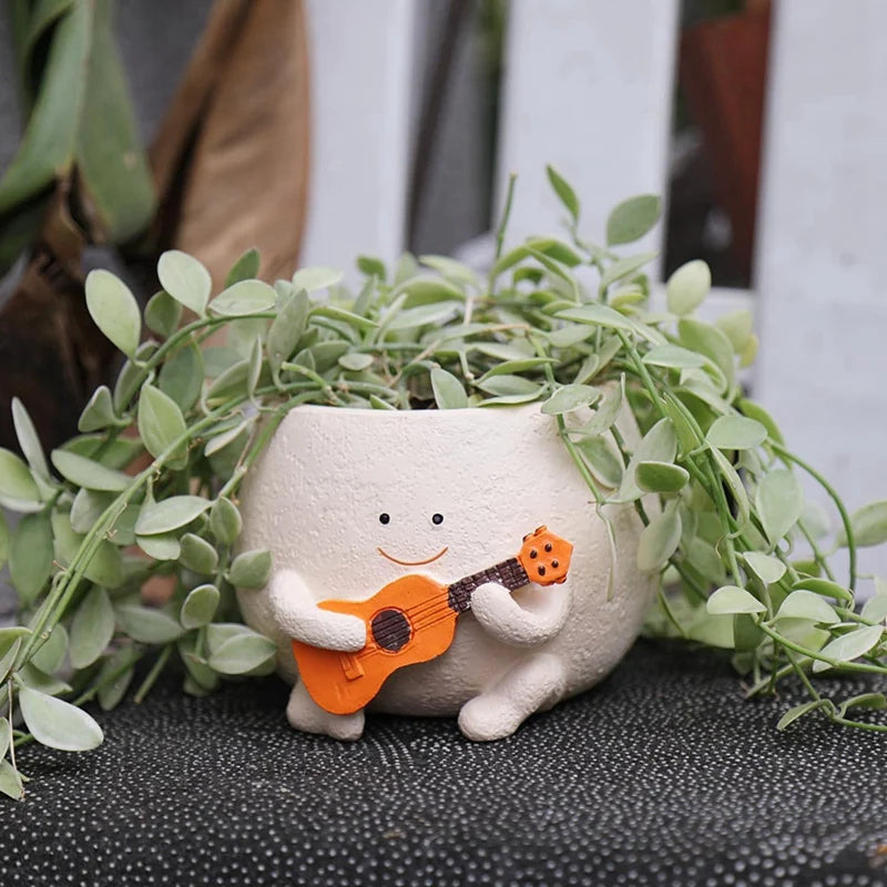 Maceta con forma de cara sonriente y orificio de drenaje, de resina, ideal para colocar en hileras de plantas, con forma de guitarra, para suculentas de interior.