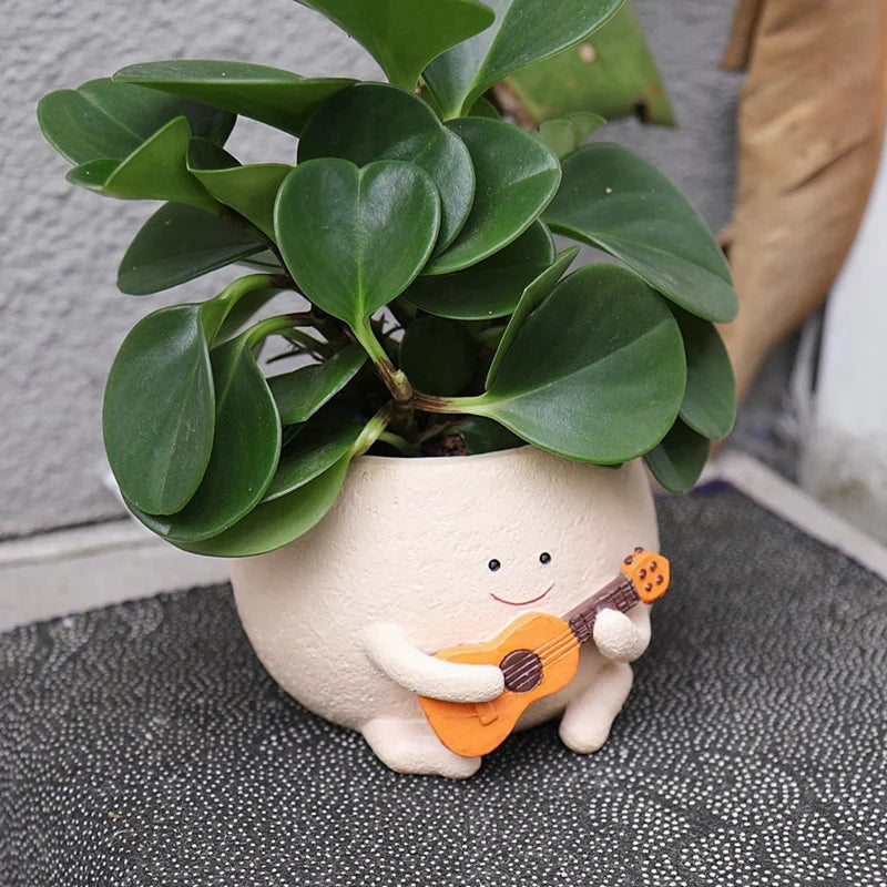 Maceta con forma de cara sonriente y orificio de drenaje, de resina, ideal para colocar en hileras de plantas, con forma de guitarra, para suculentas de interior.